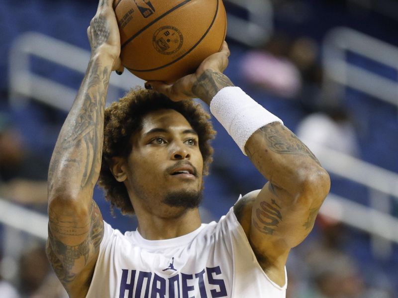 GREENSBORO, NORTH CAROLINA - OCTOBER 07: Kelly Oubre Jr. #12 of the Charlotte Hornets warms up prior to the game against the Boston Celtics at Greensboro Coliseum Complex on October 07, 2022 in Greensboro, North Carolina. NOTE TO USER: User expressly acknowledges and agrees that, by downloading and or using this photograph, User is consenting to the terms and conditions of the Getty Images License Agreement. (Photo by Jared C. Tilton/Getty Images)