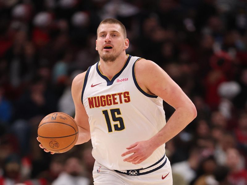 CHICAGO, ILLINOIS - JANUARY 27: Nikola Jokic #15 of the Denver Nuggets dribbles up the court against the Chicago Bulls during the first half at the United Center on January 27, 2025 in Chicago, Illinois. NOTE TO USER: User expressly acknowledges and agrees that, by downloading and or using this photograph, User is consenting to the terms and conditions of the Getty Images License Agreement.  (Photo by Michael Reaves/Getty Images)