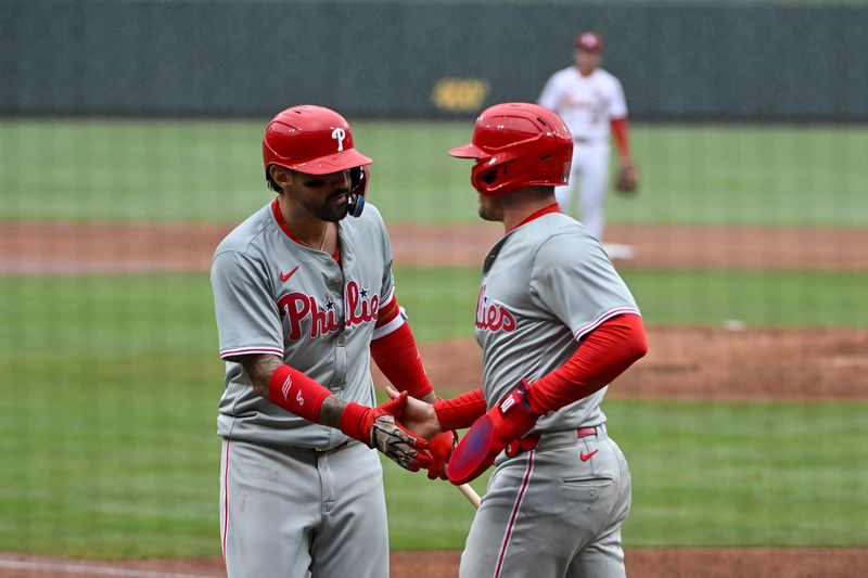 Apr 10, 2024; St. Louis, Missouri, USA;  Philadelphia Phillies catcher J.T. Realmuto (10) is congratulated by right fielder Nick Castellanos (8) after scoring against the St. Louis Cardinals during the sixth inning at Busch Stadium. Mandatory Credit: Jeff Curry-USA TODAY Sports