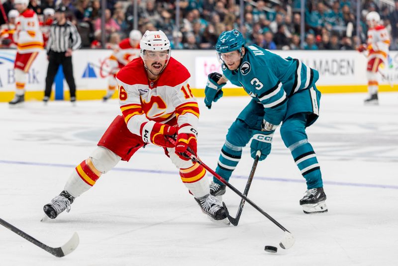 Feb 26, 2026; San Jose, California, USA; Calgary Flames center Morgan Frost (16) skates with the puck during the third period against the San Jose Sharks at SAP Center at San Jose. Mandatory Credit: Bob Kupbens-Imagn Images