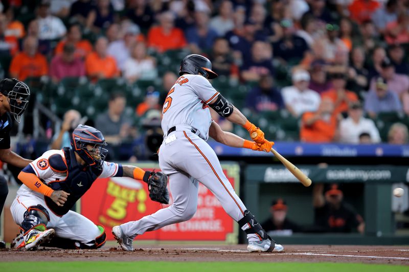 Sep 20, 2023; Houston, Texas, USA; Baltimore Orioles right fielder Anthony Santander (25) hits an RBI single against the Houston Astros during the first inning at Minute Maid Park. Mandatory Credit: Erik Williams-USA TODAY Sports