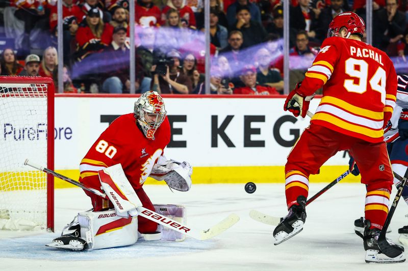 Dec 3, 2024; Calgary, Alberta, CAN; Calgary Flames goaltender Dan Vladar (80) makes a save against the Columbus Blue Jackets during the third period at Scotiabank Saddledome. Mandatory Credit: Sergei Belski-Imagn Images
