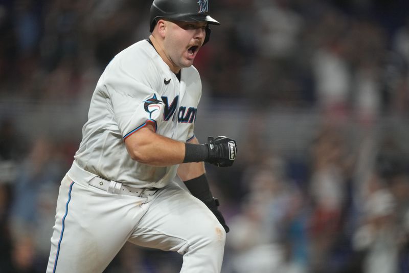 Sep 19, 2023; Miami, Florida, USA;  Miami Marlins third baseman Jake Burger (36) celebrates hitting the game winning RBI single in the ninth inning against the New York Mets at loanDepot Park. Mandatory Credit: Jim Rassol-USA TODAY Sports