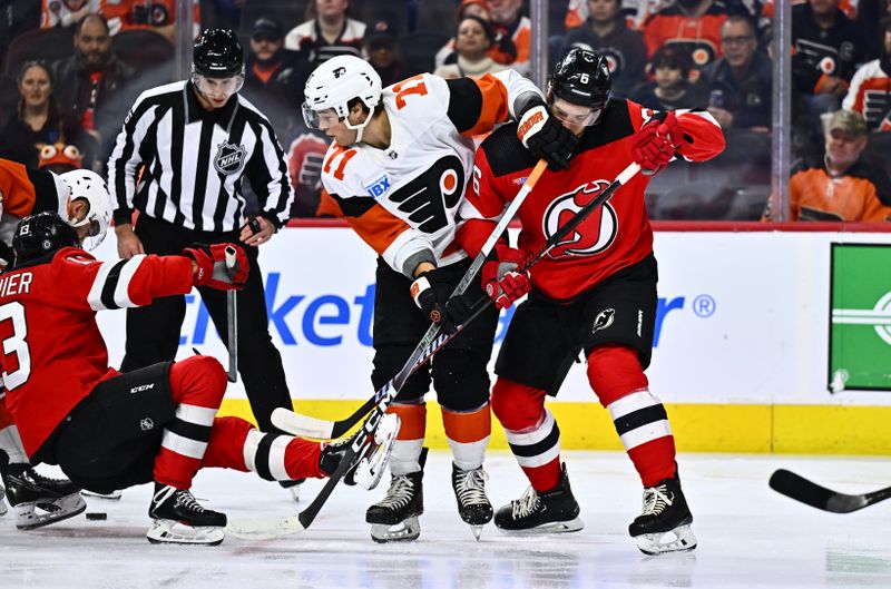 Apr 13, 2024; Philadelphia, Pennsylvania, USA; Philadelphia Flyers right wing Tyson Foerster (71) collides with New Jersey Devils defenseman John Marino (6) in the first period at Wells Fargo Center. Mandatory Credit: Kyle Ross-USA TODAY Sports