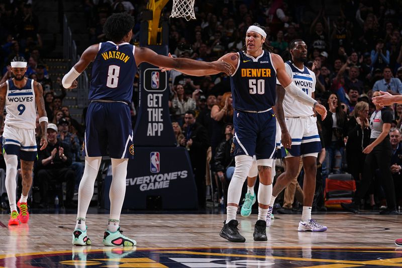 DENVER, CO - APRIL 10: Aaron Gordon #50 of the Denver Nuggets high fives Peyton Watson #8 during the game against the Minnesota Timberwolves on April 10, 2024 at the Ball Arena in Denver, Colorado. NOTE TO USER: User expressly acknowledges and agrees that, by downloading and/or using this Photograph, user is consenting to the terms and conditions of the Getty Images License Agreement. Mandatory Copyright Notice: Copyright 2024 NBAE (Photo by Bart Young/NBAE via Getty Images)