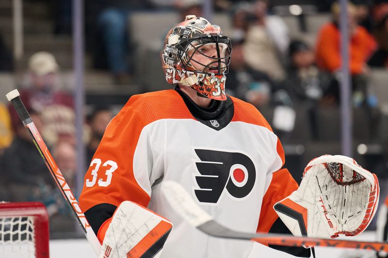 Nov 7, 2023; San Jose, California, USA; Philadelphia Flyers goaltender Samuel Ersson (33) watches the play against the San Jose Sharks during the third period at SAP Center at San Jose. Mandatory Credit: Robert Edwards-USA TODAY Sports