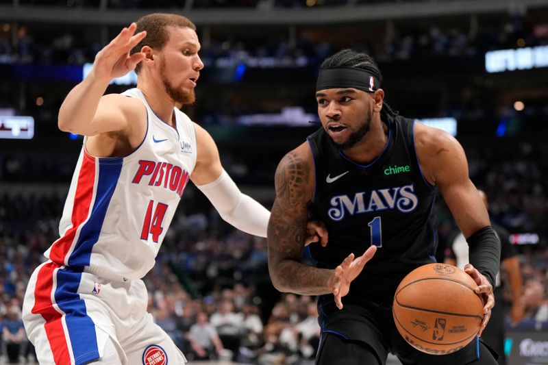 DALLAS, TEXAS - APRIL 12: Jaden Hardy #1 of the Dallas Mavericks is defended by Malachi Flynn #14 of the Detroit Pistons during the first half at American Airlines Center on April 12, 2024 in Dallas, Texas. NOTE TO USER: User expressly acknowledges and agrees that, by downloading and or using this photograph, User is consenting to the terms and conditions of the Getty Images License Agreement. (Photo by Sam Hodde/Getty Images)