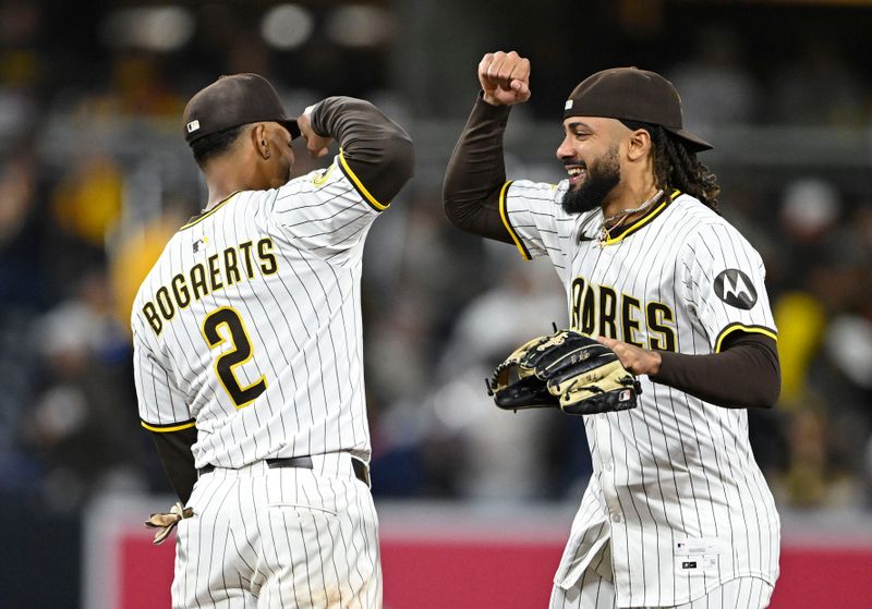 Apr 29, 2025; San Diego, California, USA; San Diego Padres shortstop Xander Bogaerts (2) and outfielder Fernando Tatis Jr. (23) celebrate after the Padres defeated the San Francisco Giants 7-4 at Petco Park. Mandatory Credit: Denis Poroy-Imagn Images