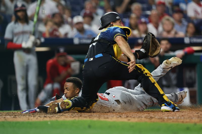 Aug 16, 2024; Philadelphia, Pennsylvania, USA; Washington Nationals shortstop Nasim Nunez (26) slides past Philadelphia Phillies catcher J.T. Realmuto (10) for a run during the ninth inning at Citizens Bank Park. Mandatory Credit: Bill Streicher-USA TODAY Sports