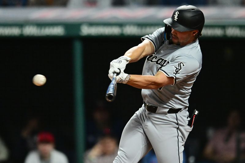 Apr 9, 2024; Cleveland, Ohio, USA; Chicago White Sox center fielder Dominic Fletcher (7) hits an RBI double during the eighth inning against the Cleveland Guardians at Progressive Field. Mandatory Credit: Ken Blaze-USA TODAY Sports