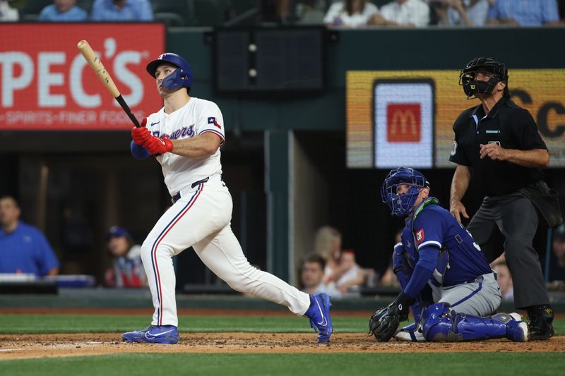 Jun 22, 2024; Arlington, Texas, USA; Texas Rangers left fielder Wyatt Langford (36) hits a grand slam home run in the eighth inning against the Kansas City Royals at Globe Life Field. Mandatory Credit: Tim Heitman-USA TODAY Sports