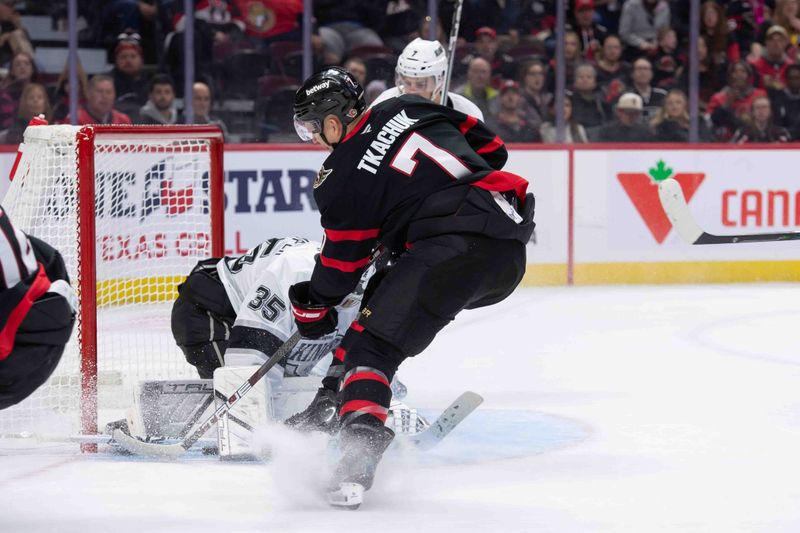 Oct 14, 2024; Ottawa, Ontario, CAN; Los Angeles Kings goalie Darcy Kuemper (35) makes a save on a shot from Ottawa Senators lef wing Brady Tkachuk (7) in the first period at the Canadian Tire Centre. Mandatory Credit: Marc DesRosiers-Imagn Images