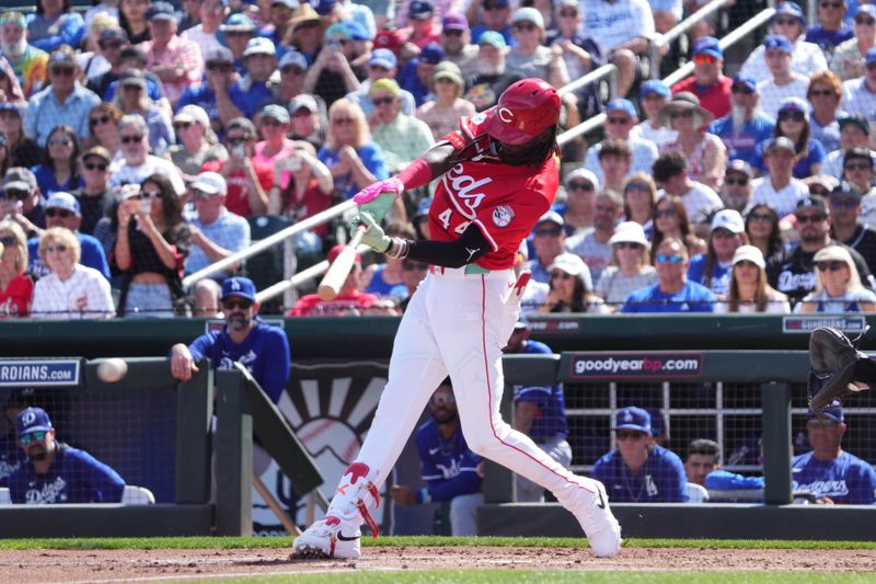 Feb 24, 2025; Goodyear, Arizona, USA; Cincinnati Reds shortstop Elly De La Cruz (44) hits a single against the Los Angeles Dodgers during the first inning at Goodyear Ballpark. Mandatory Credit: Joe Camporeale-Imagn Images