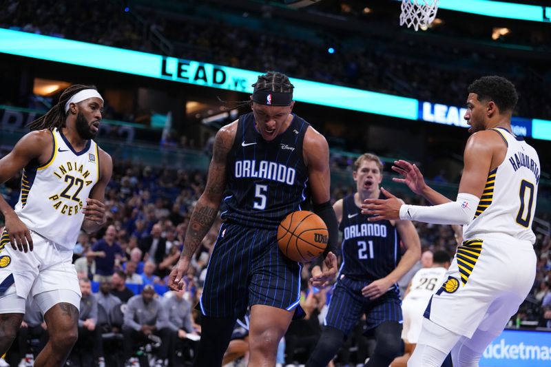 ORLANDO, FLORIDA - OCTOBER 28: Paolo Banchero #5 of the Orlando Magic reacts after dunking the ball against the Indiana Pacers during the first quarter at Kia Center on October 28, 2024 in Orlando, Florida. NOTE TO USER: User expressly acknowledges and agrees that, by downloading and or using this photograph, User is consenting to the terms and conditions of the Getty Images License Agreement. (Photo by Rich Storry/Getty Images)