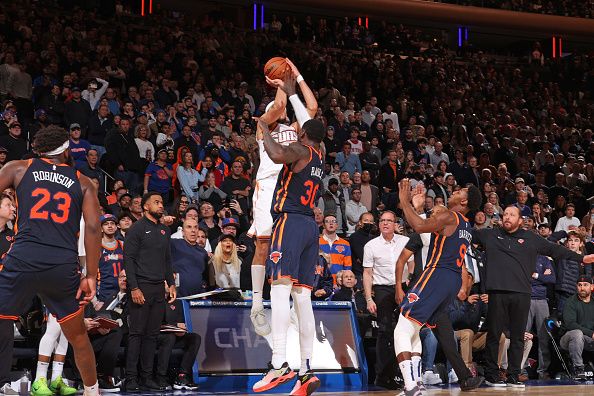 NEW YORK, NY - NOVEMBER 26: Devin Booker #1 of the Phoenix Suns shoots game winning three point basket during the game against the New York Knicks on November 26, 2023 at Madison Square Garden in New York City, New York.  NOTE TO USER: User expressly acknowledges and agrees that, by downloading and or using this photograph, User is consenting to the terms and conditions of the Getty Images License Agreement. Mandatory Copyright Notice: Copyright 2023 NBAE  (Photo by Nathaniel S. Butler/NBAE via Getty Images)