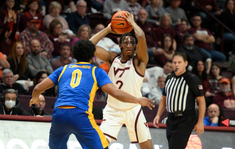 Feb 18, 2023; Blacksburg, Virginia, USA;  Virginia Tech Hokies guard MJ Collins (2) controls the ball against Pittsburgh Panthers guard Nelly Cummings (0) in the second half at Cassell Coliseum. Mandatory Credit: Lee Luther Jr.-USA TODAY Sports