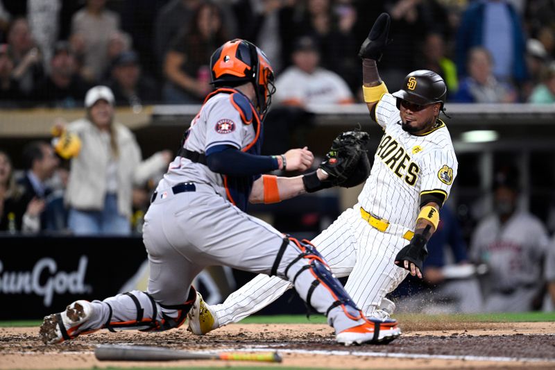 Sep 16, 2024; San Diego, California, USA; San Diego Padres designated hitter Luis Arraez (4) is tagged out at home by Houston Astros catcher Victor Caratini (17) during the fifth inning at Petco Park. Mandatory Credit: Orlando Ramirez-Imagn Images