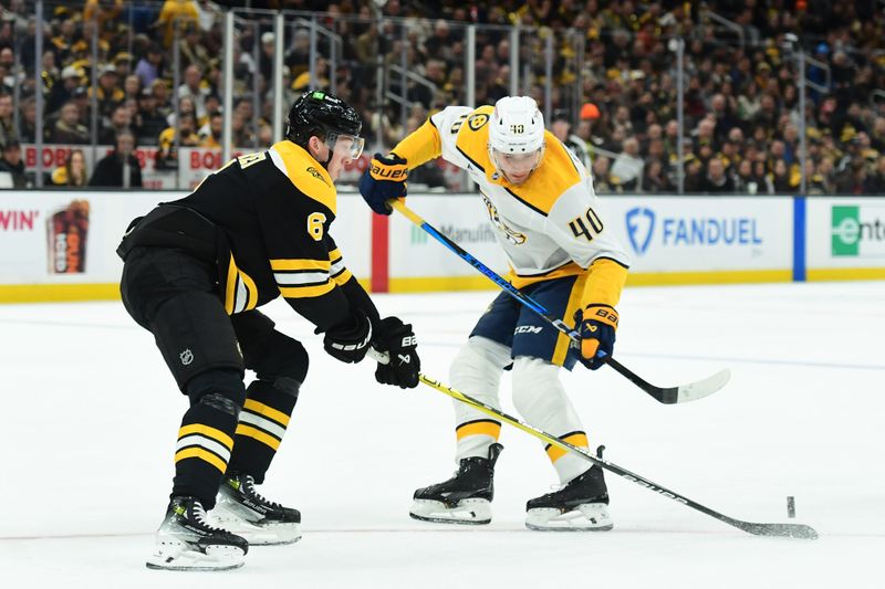 Mar 4, 2025; Boston, Massachusetts, USA;  Boston Bruins defenseman Mason Lohrei (6) pokes the puck away from Nashville Predators center Fedor Svechkov (40) during the second period at TD Garden. Mandatory Credit: Bob DeChiara-Imagn Images