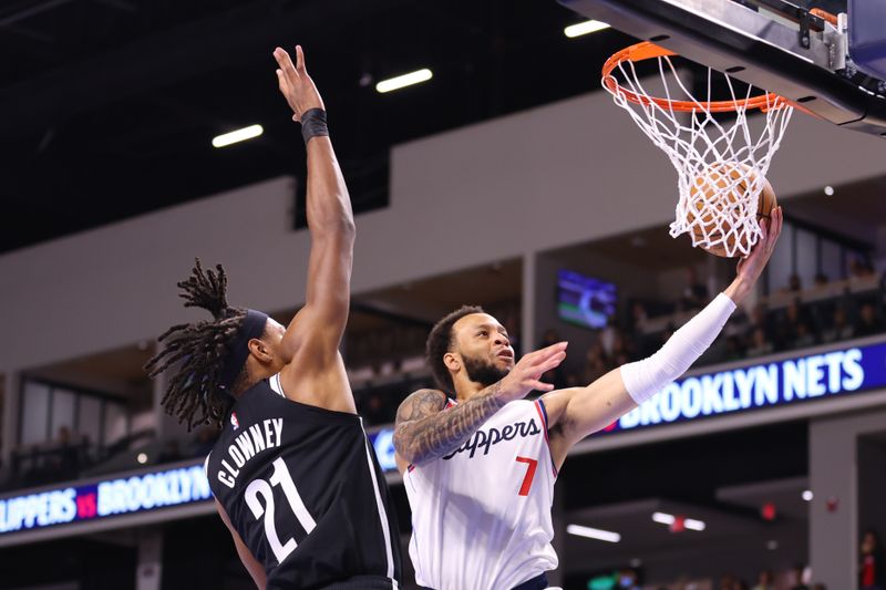 OCEANSIDE, CALIFORNIA - OCTOBER 08:  Noah Clowney #21 of the Brooklyn Nets and Amir Coffey #7 of the Los Angeles Clippers fight at the basket during the preseason game at Frontwave Arena on October 08, 2024 in Oceanside, California. NOTE TO USER: User expressly acknowledges and agrees that, by downloading and or using this photograph, User is consenting to the terms and conditions of the Getty Images License Agreement. (Photo by Joe Scarnici/Getty Images)