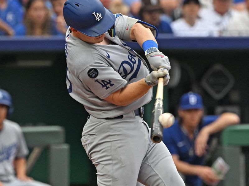 Jun 29, 2025; Kansas City, Missouri, USA;  Los Angeles Dodgers catcher Will Smith (16) hits a solo home run in the sixth inning against the Kansas City Royals at Kauffman Stadium. Mandatory Credit: Peter Aiken-Imagn Images