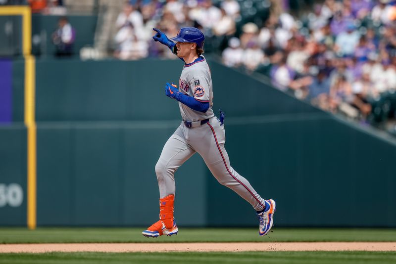 Jun 8, 2025; Denver, Colorado, USA; New York Mets third baseman Brett Baty (7) gestures as he rounds the bases on a two run home run in the seventh inning against the Colorado Rockies at Coors Field. Mandatory Credit: Isaiah J. Downing-Imagn Images
