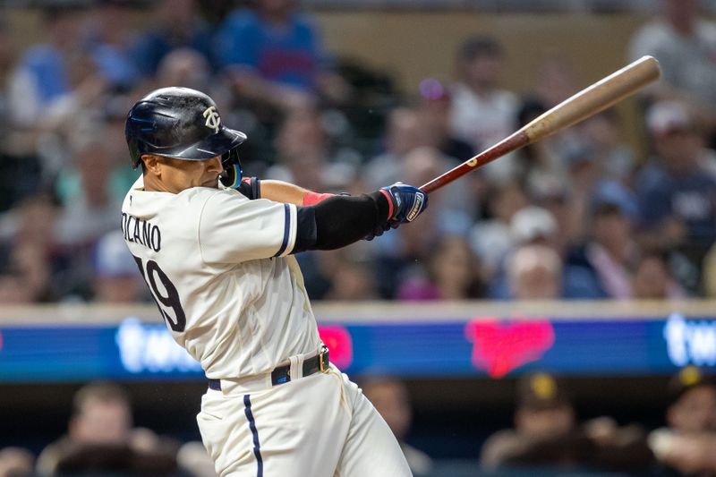 May 10, 2023; Minneapolis, Minnesota, USA; Minnesota Twins first baseman Donovan Solano (39) hits a RBI single in the tenth inning against the San Diego Padres at Target Field. Mandatory Credit: Jesse Johnson-USA TODAY Sports