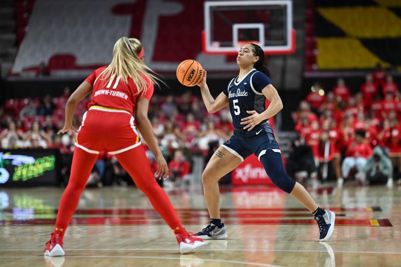 Feb 18, 2024; College Park, Maryland, USA;  Penn State Nittany Lions guard Leilani Kapinus (5) passes as Maryland Terrapins guard Jakia Brown-Turner (11) defends during the first half at Xfinity Center. Mandatory Credit: Tommy Gilligan-USA TODAY Sports