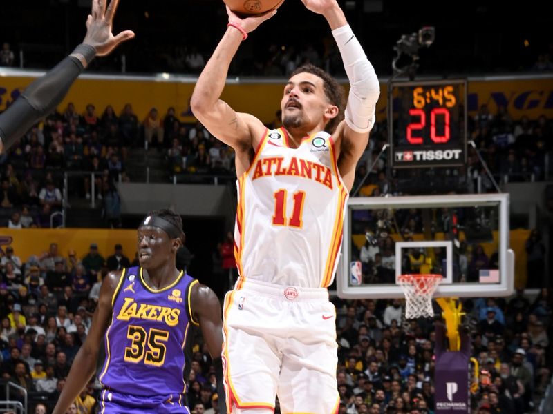 LOS ANGELES, CA - JANUARY 6: Trae Young #11 of the Atlanta Hawks shoots the ball during the game against the Los Angeles Lakers on January 6, 2023 at Crypto.Com Arena in Los Angeles, California. NOTE TO USER: User expressly acknowledges and agrees that, by downloading and/or using this Photograph, user is consenting to the terms and conditions of the Getty Images License Agreement. Mandatory Copyright Notice: Copyright 2023 NBAE (Photo by Andrew D. Bernstein/NBAE via Getty Images)