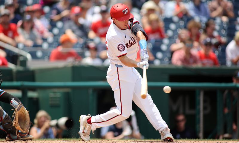 Jun 16, 2024; Washington, District of Columbia, USA; Washington Nationals outfielder Jacob Young (30) puts the ball in play for a single during the second inning in a game against the Miami Marlins at Nationals Park. Mandatory Credit: Daniel Kucin Jr.-USA TODAY Sports