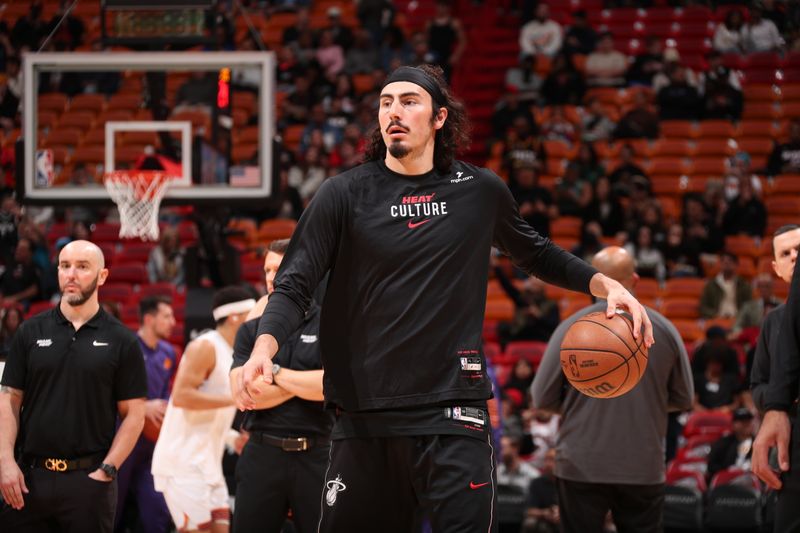 MIAMI, FL - JANUARY 29: Jaime Jaquez Jr. #11 of the Miami Heat looks on before the game against the Phoenix Suns on January 29, 2024 at Kaseya Center in Miami, Florida. NOTE TO USER: User expressly acknowledges and agrees that, by downloading and or using this Photograph, user is consenting to the terms and conditions of the Getty Images License Agreement. Mandatory Copyright Notice: Copyright 2024 NBAE (Photo by Issac Baldizon/NBAE via Getty Images)