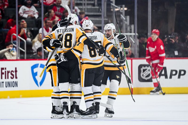 Oct 10, 2024; Detroit, Michigan, USA; Pittsburgh Penguins defenseman Marcus Pettersson (28) celebrates his goal with teammates during the second period against the Detroit Red Wings at Little Caesars Arena. Mandatory Credit: Tim Fuller-Imagn Images