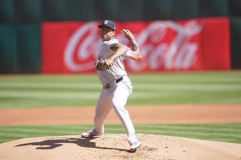 Sep 22, 2024; Oakland, California, USA; New York Yankees pitcher Luis Gil (81) delivers a pitch against the Oakland Athletics in the first inning at the Oakland-Alameda County Coliseum. Mandatory Credit: Cary Edmondson-Imagn Images