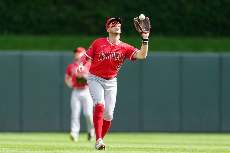 Sep 24, 2023; Minneapolis, Minnesota, USA; Los Angeles Angels shortstop Zach Neto (9) catches a fly ball to retire Minnesota Twins third baseman Jorge Polanco (11) in the first inning at Target Field. Mandatory Credit: Matt Blewett-USA TODAY Sports