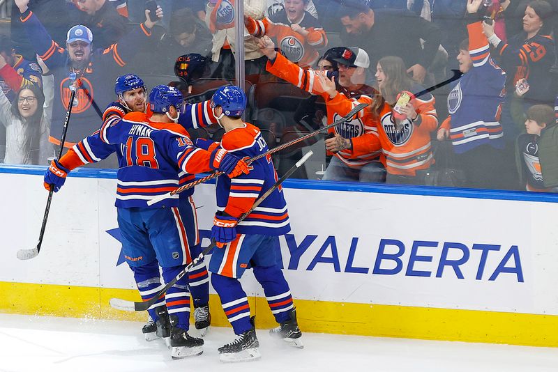 Feb 28, 2024; Edmonton, Alberta, CAN; The Edmonton Oilers celebrate a goal scored by forward Connor McDavid (97) during overtime against the St. Louis Blues at Rogers Place. Mandatory Credit: Perry Nelson-USA TODAY Sports