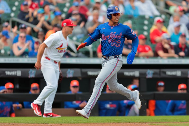 Feb 24, 2025; Jupiter, Florida, USA; New York Mets right fielder Juan Soto (22) scores against the St. Louis Cardinals during the third inning at Roger Dean Chevrolet Stadium. Mandatory Credit: Sam Navarro-Imagn Images