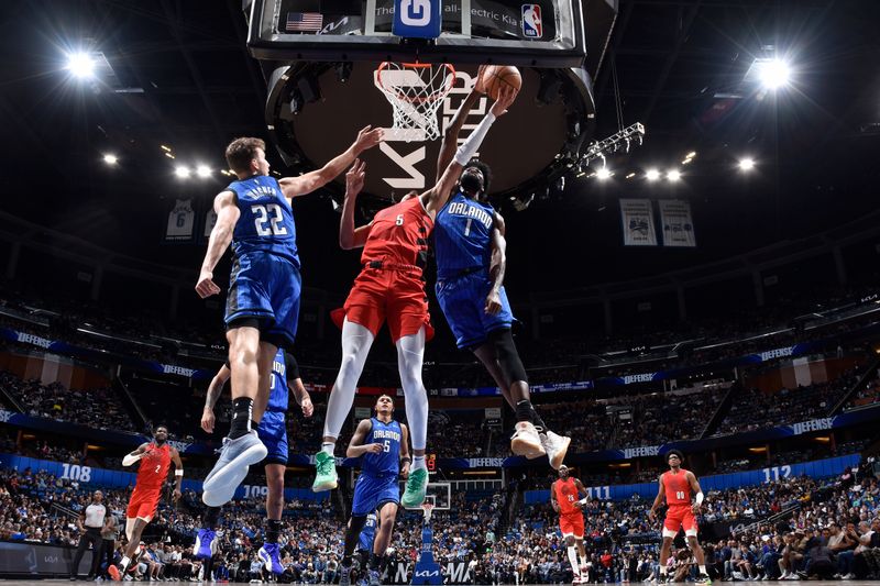 ORLANDO, FL - APRIL 1: Dalano Banton #5 of the Portland Trail Blazers drives to the basket during the game against the Orlando Magic on April 1, 2024 at Kia Center in Orlando, Florida. NOTE TO USER: User expressly acknowledges and agrees that, by downloading and or using this photograph, User is consenting to the terms and conditions of the Getty Images License Agreement. Mandatory Copyright Notice: Copyright 2024 NBAE (Photo by Fernando Medina/NBAE via Getty Images)