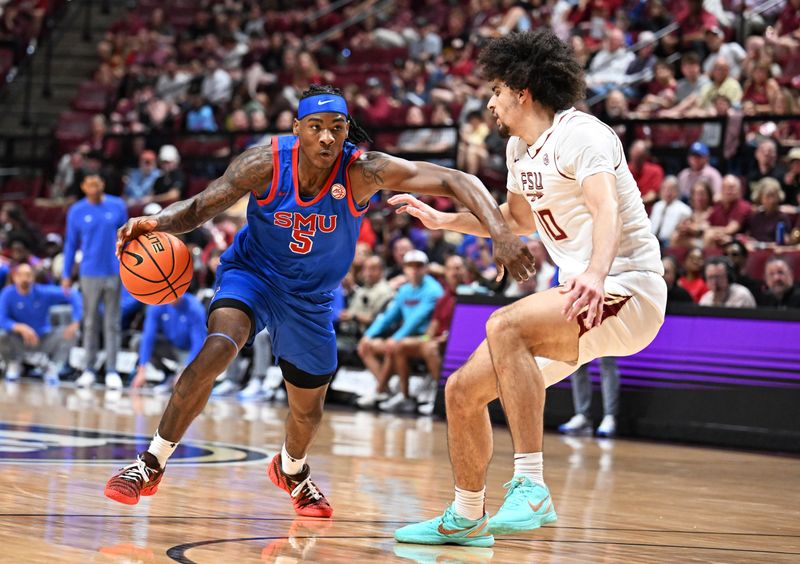 Mar 7, 2026; Tallahassee, Florida, USA; Southern Methodist Mustangs guard Jaron Pierre Jr. (5) drives to the net past Florida State Seminoles guard Lajae Jones (10) during the first half at Donald L. Tucker Center. Mandatory Credit: Melina Myers-Imagn Images