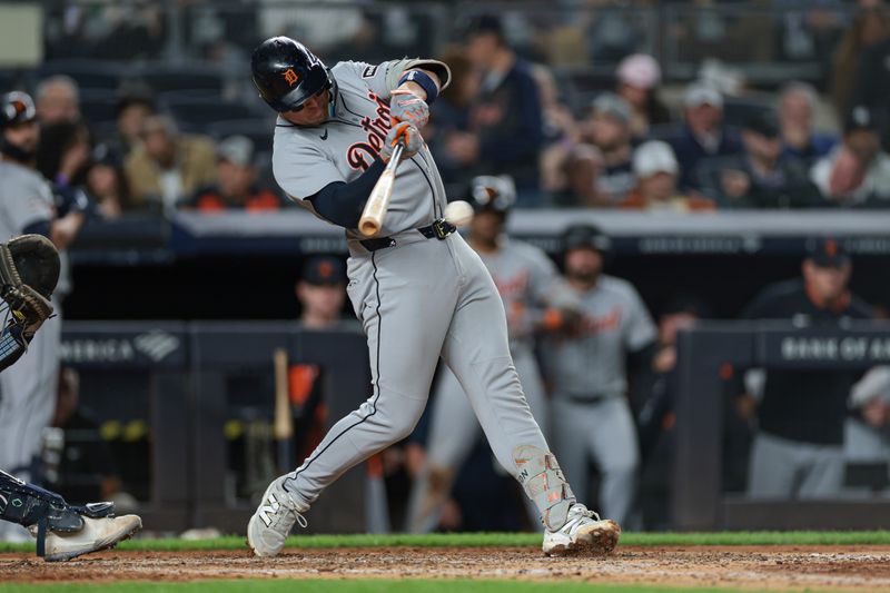 Sep 10, 2025; Bronx, New York, USA;  Detroit Tigers first baseman Spencer Torkelson (20) singles during the sixth inning against the New York Yankees at Yankee Stadium. Mandatory Credit: Vincent Carchietta-Imagn Images