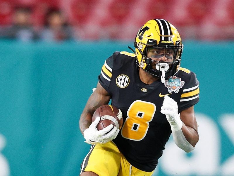 Dec 23, 2022; Tampa, Florida, USA; Missouri Tigers running back Nathaniel Peat (8) runs with the ball against the Wake Forest Demon Deacons in the fourth quarter in the 2022 Gasparilla Bowl at Raymond James Stadium. Mandatory Credit: Nathan Ray Seebeck-USA TODAY Sports