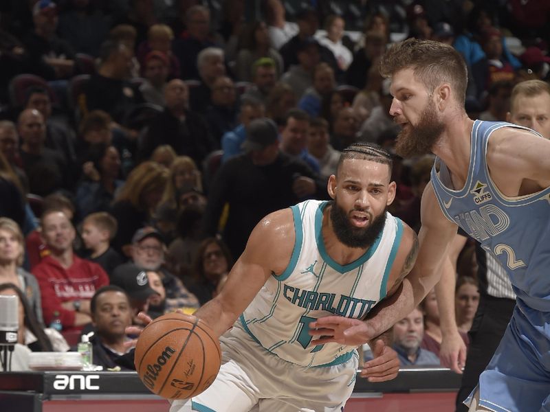 CLEVELAND, OH - NOVEMBER 17: Cody Martin #11 of the Charlotte Hornets dribbles the ball during the game against the Cleveland Cavaliers on November 17, 2024 at Rocket Mortgage FieldHouse in Cleveland, Ohio. NOTE TO USER: User expressly acknowledges and agrees that, by downloading and/or using this Photograph, user is consenting to the terms and conditions of the Getty Images License Agreement. Mandatory Copyright Notice: Copyright 2024 NBAE (Photo by David Liam Kyle/NBAE via Getty Images)