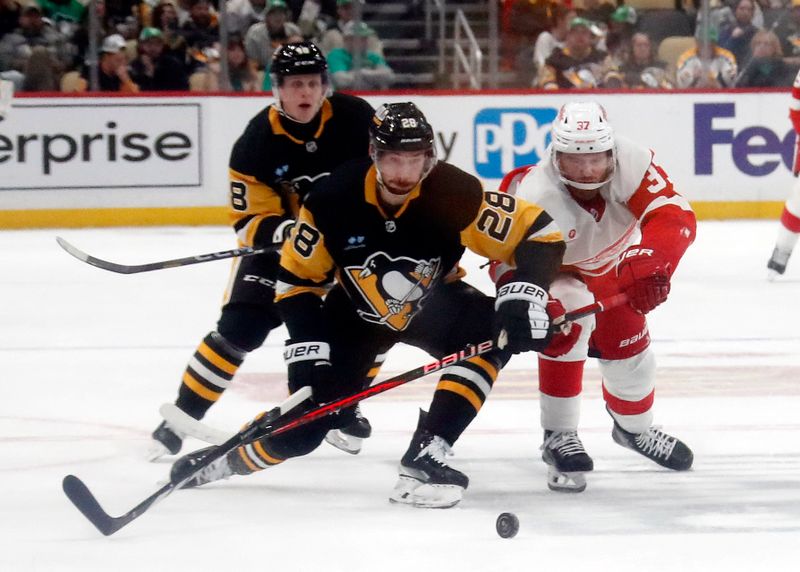 Mar 17, 2024; Pittsburgh, Pennsylvania, USA;  Pittsburgh Penguins defenseman Marcus Pettersson (28) and Detroit Red Wings left wing J.T. Compher (37) chase the puck during the second period at PPG Paints Arena. Mandatory Credit: Charles LeClaire-USA TODAY Sports