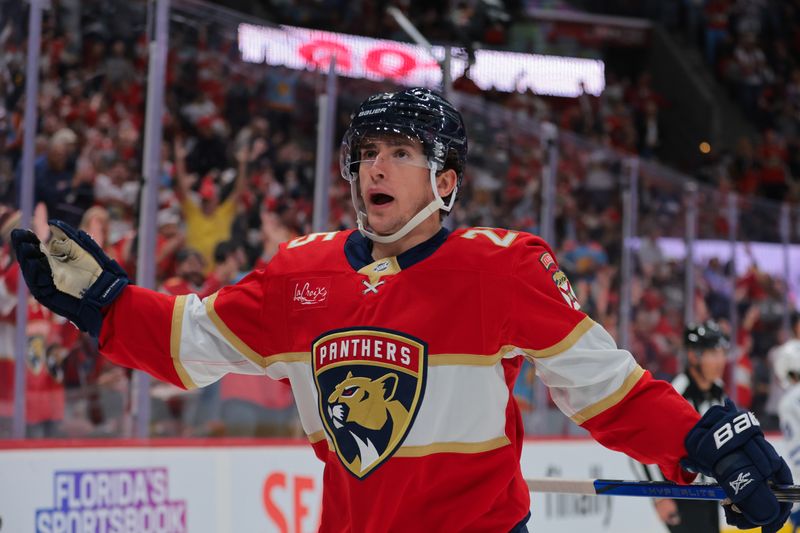 Nov 27, 2024; Sunrise, Florida, USA; Florida Panthers right wing Mackie Samoskevich (25) celebrates after scoring against the Toronto Maple Leafs during the first period at Amerant Bank Arena. Mandatory Credit: Sam Navarro-Imagn Images