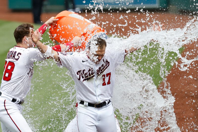 May 4, 2023; Washington, District of Columbia, USA; Washington Nationals left fielder Alex Call (17) is doused with ice water by teammates after hitting a walk-off home run against the Chicago Cubs during the ninth inning at Nationals Park. Mandatory Credit: Geoff Burke-USA TODAY Sports