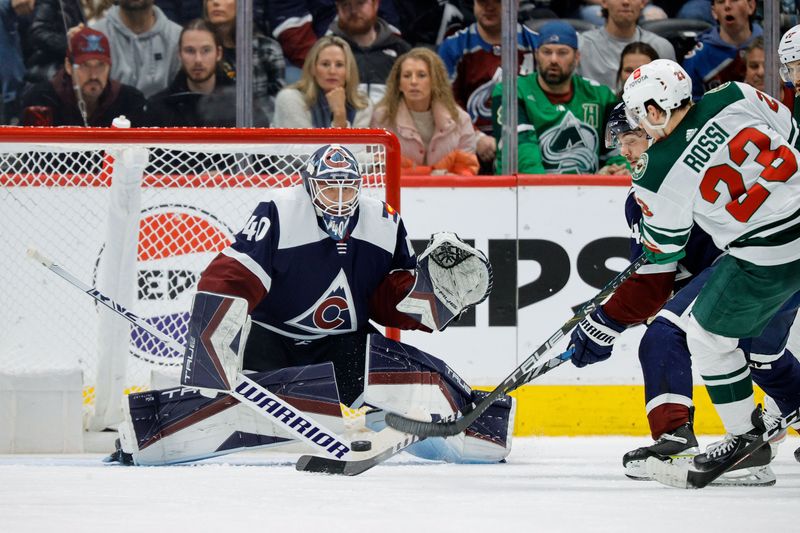 Mar 8, 2024; Denver, Colorado, USA; Minnesota Wild center Marco Rossi (23) attempts a shot against Colorado Avalanche goaltender Alexandar Georgiev (40) in the second period at Ball Arena. Mandatory Credit: Isaiah J. Downing-USA TODAY Sports