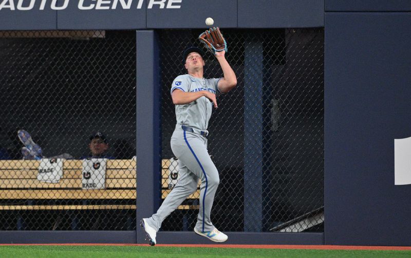 Apr 30, 2024; Toronto, Ontario, CAN;   Kansas City Royals right fielder Hunter Renfroe (16) catches a fly ball hit by Toronto Blue Jays catcher Alejandro Kirk (not shown) in the fifth inning at Rogers Centre. Mandatory Credit: Dan Hamilton-USA TODAY Sports
