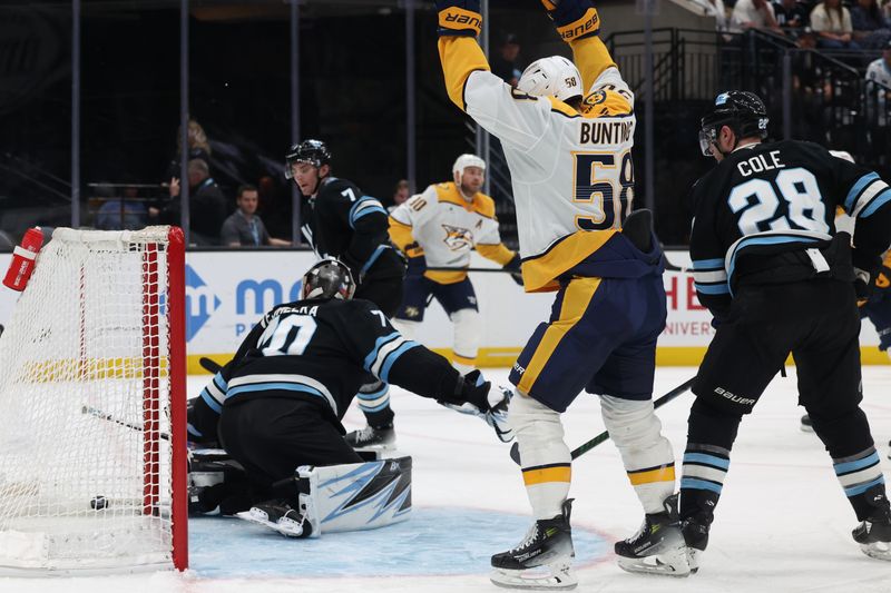 Apr 10, 2025; Salt Lake City, Utah, USA; The Nashville Predators celebrate a goal against the Utah Hockey Club during the second period at Delta Center. Mandatory Credit: Rob Gray-Imagn Images