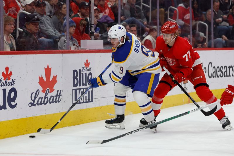 Apr 7, 2024; Detroit, Michigan, USA; Buffalo Sabres left wing Zach Benson (9) skates with the puck chased by Detroit Red Wings defenseman Simon Edvinsson (77) in the third period at Little Caesars Arena. Mandatory Credit: Rick Osentoski-USA TODAY Sports