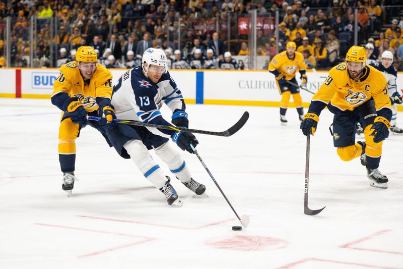 Nov 23, 2024; Nashville, Tennessee, USA;  Nashville Predators defenseman Brady Skjei (76), defenseman Roman Josi (59), and Winnipeg Jets center Gabriel Vilardi (13) fight for the puck during the second period at Bridgestone Arena. Mandatory Credit: Steve Roberts-Imagn Images