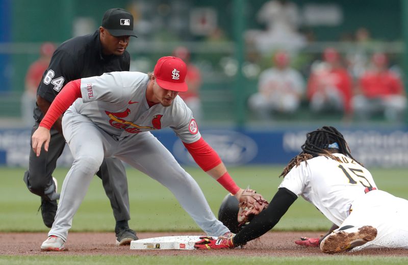 Jul 22, 2024; Pittsburgh, Pennsylvania, USA;  Pittsburgh Pirates shortstop Oneil Cruz (15) steals second base against a late tag by St. Louis Cardinals second baseman Nolan Gorman (left) during the first inning at PNC Park. Mandatory Credit: Charles LeClaire-USA TODAY Sports