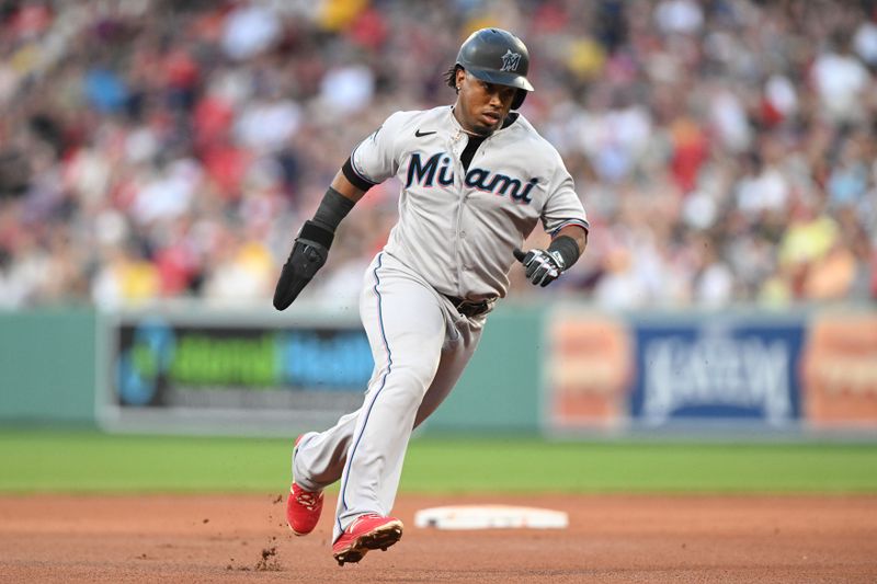 Jun 29, 2023; Boston, Massachusetts, USA; Miami Marlins third baseman Jean Segura (9) runs towards third base during the eighth inning of a game against the Boston Red Sox at Fenway Park. Mandatory Credit: Brian Fluharty-USA TODAY Sports